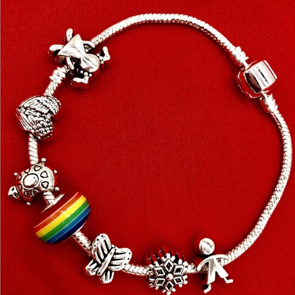 925 sterling silver bracelet,5 FREE charms of your choice,8.5” long,barrel clasp